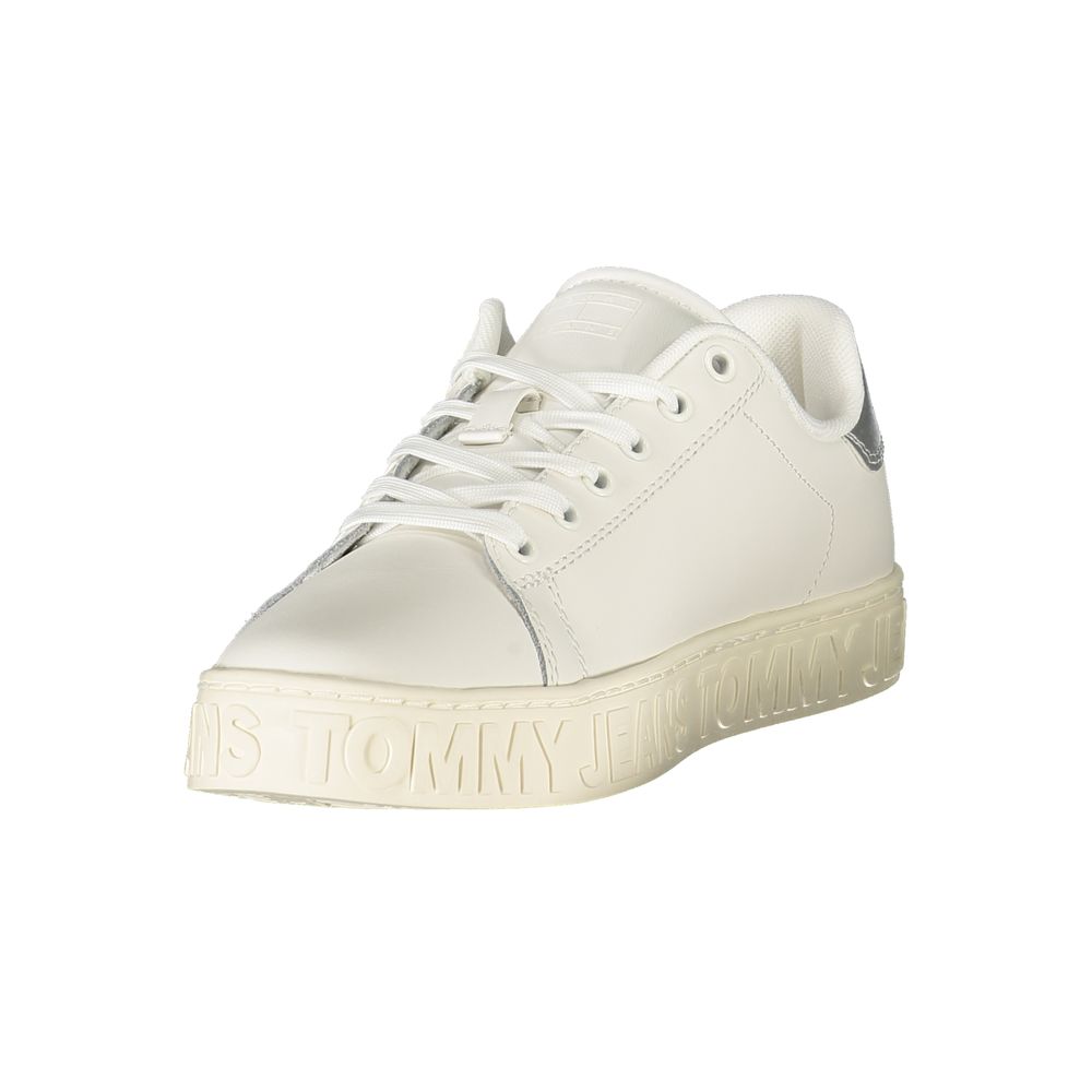 White Tommy Hilfiger sneaker with light sole and dark heel detail, angled front view