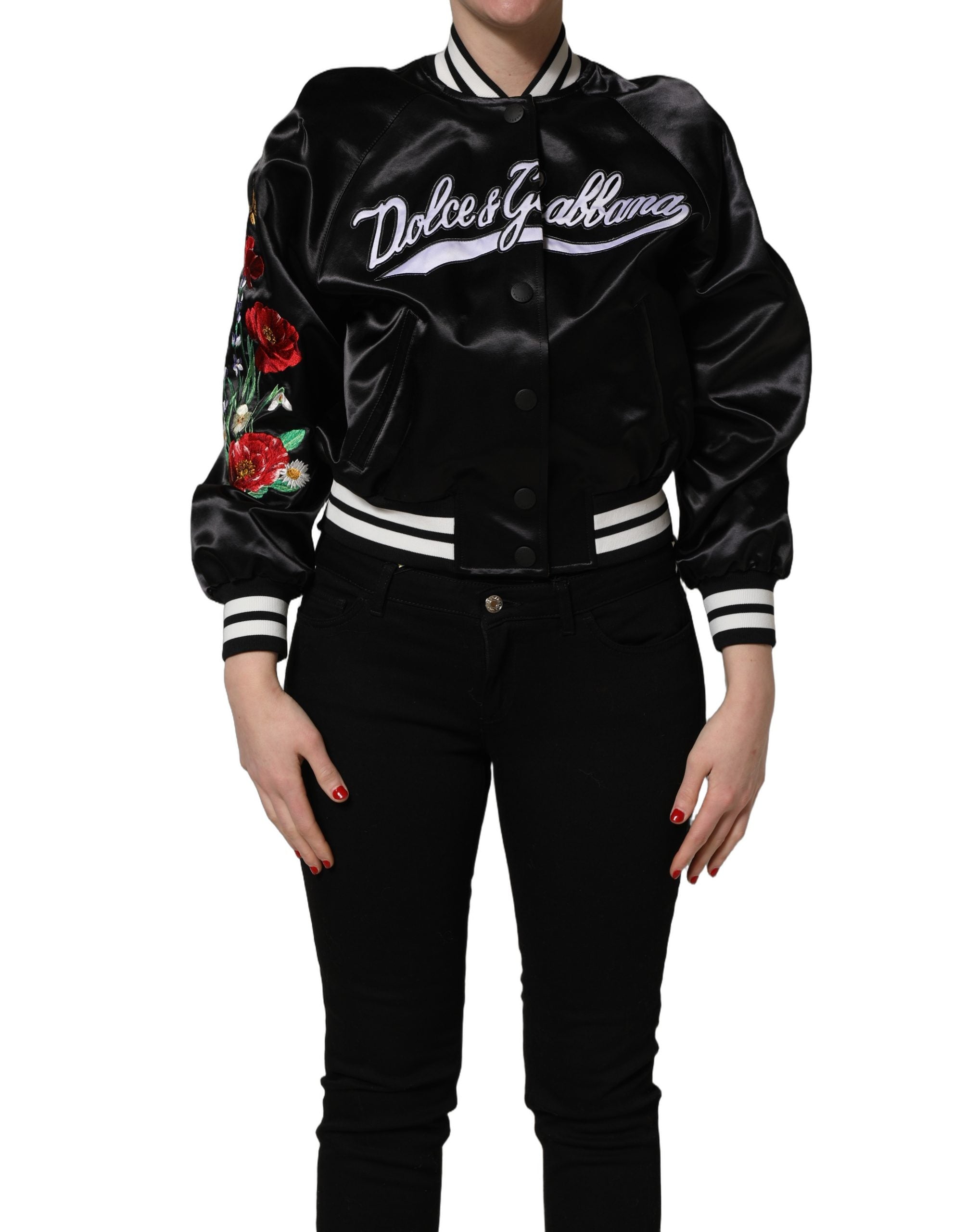 Black satin jacket front view with white striped edges and colorful floral embroidery on the sleeve