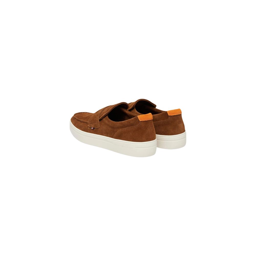 Brown Tommy Hilfiger loafers with orange heel details, angled rear view