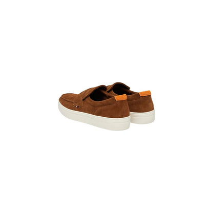 Brown Tommy Hilfiger loafers with orange heel details, angled rear view