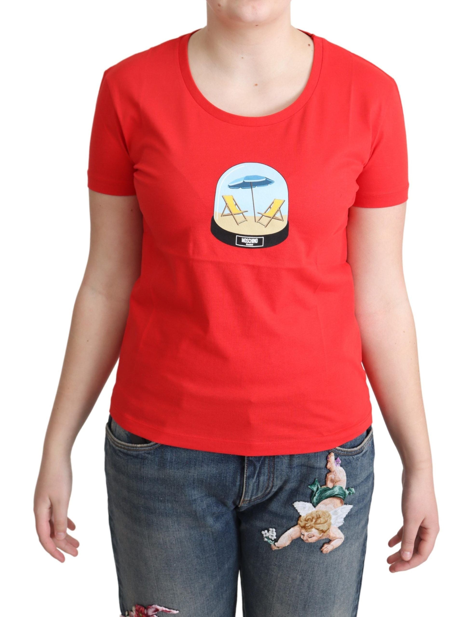 Red t-shirt front view with round neckline and print of two beach chairs and umbrella inside snow globe
