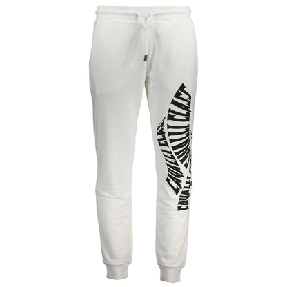 White joggers viewed from front with black text print on one leg and drawstring at waist.