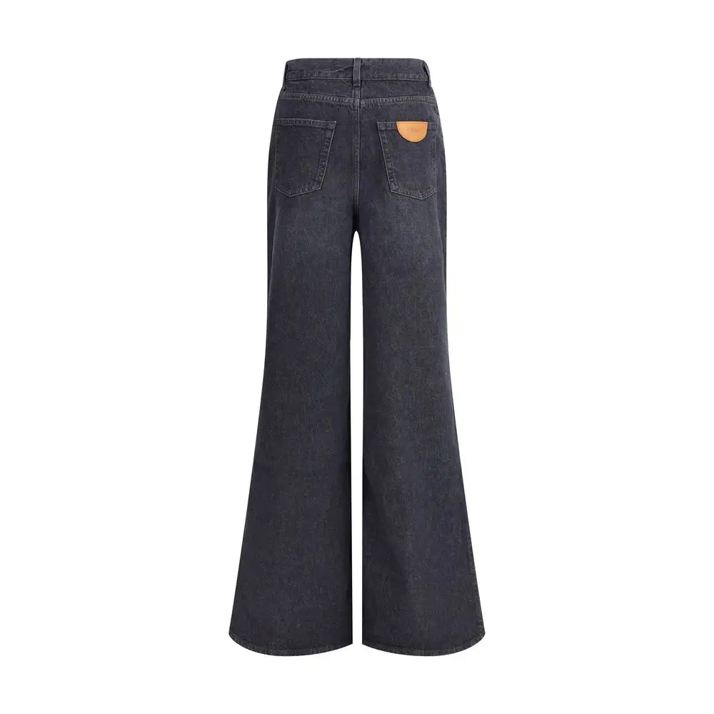 Chloé wide-leg jeans i dark wash denim med tan læderpatch. Spar 30-70% på mode