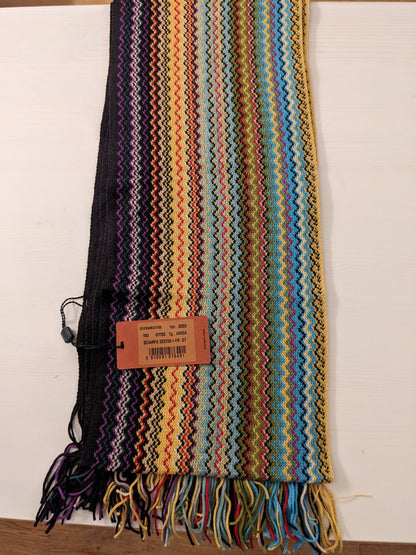 Missoni scarf folded with zigzag stripes in blue, yellow, red, green, purple and black